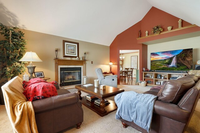 carpeted living room with high vaulted ceiling