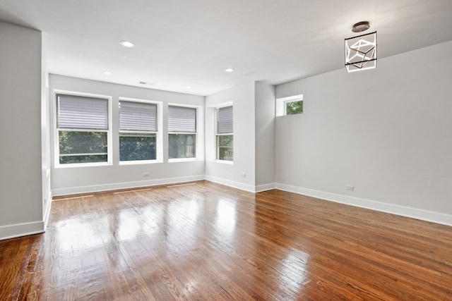 unfurnished living room featuring hardwood / wood-style floors