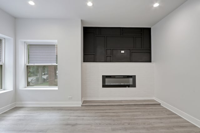 unfurnished living room featuring light hardwood / wood-style flooring