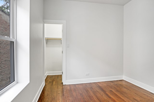 empty room featuring wood-type flooring