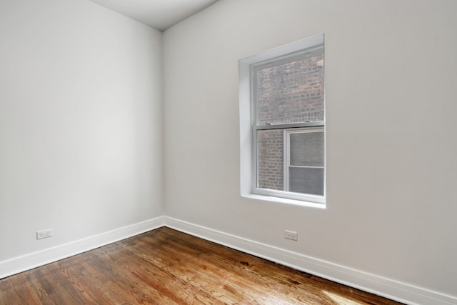 spare room featuring hardwood / wood-style floors