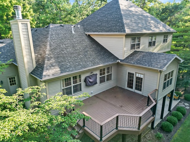 back of property featuring a deck