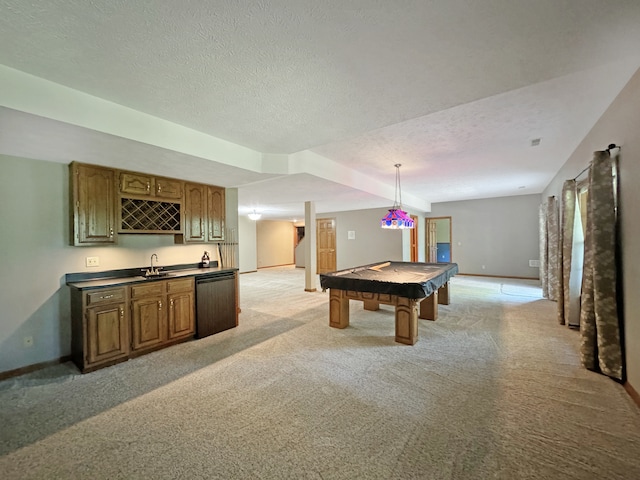 playroom featuring pool table, sink, a textured ceiling, and light carpet