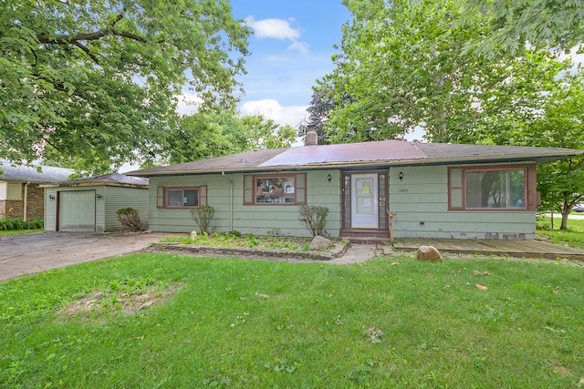 single story home featuring a garage and a front lawn