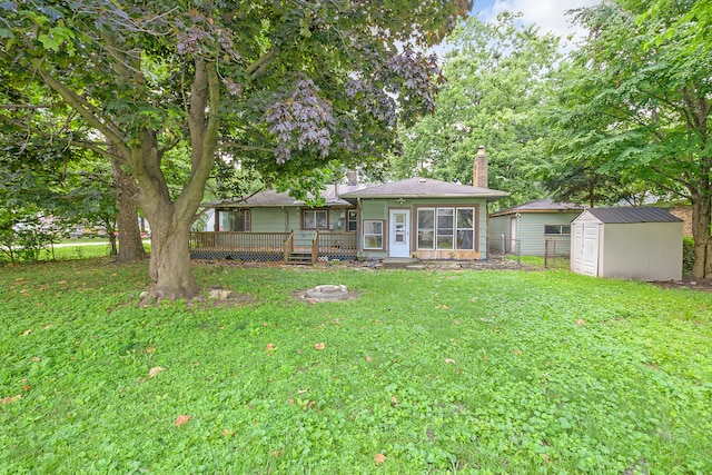 view of yard with a shed and a deck