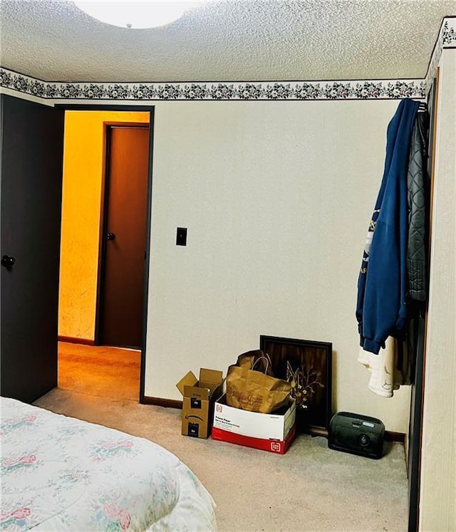 carpeted bedroom with a textured ceiling