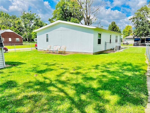 back of property with a lawn