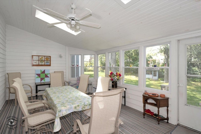 sunroom / solarium with lofted ceiling, ceiling fan, wooden ceiling, and a healthy amount of sunlight