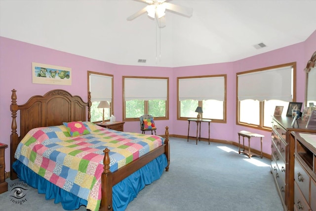 bedroom featuring carpet floors, visible vents, a ceiling fan, and lofted ceiling