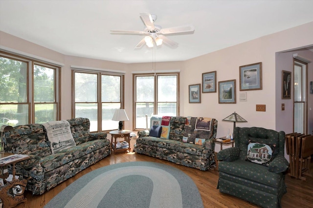 living room featuring ceiling fan and wood finished floors