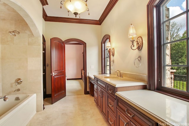 bathroom featuring vanity, crown molding, and shower / bathing tub combination