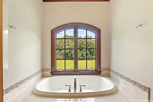 bathroom with tiled bath