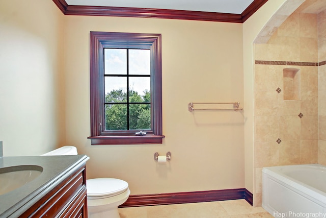 bathroom with ornamental molding, vanity, and toilet