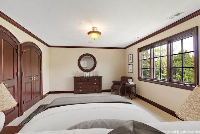 carpeted bedroom with crown molding