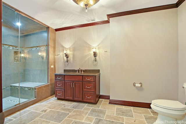 bathroom featuring vanity, an enclosed shower, crown molding, and toilet