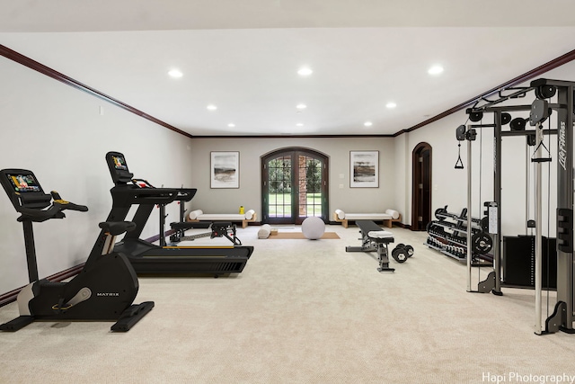 exercise room featuring french doors, light colored carpet, and ornamental molding