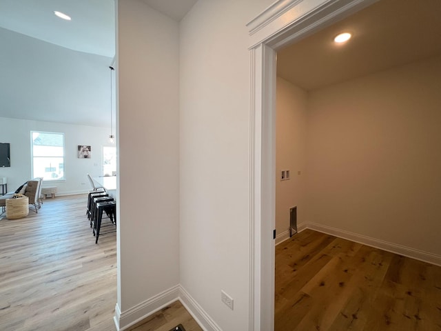 laundry room with light hardwood / wood-style flooring