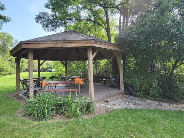 view of home's community with a gazebo and a yard