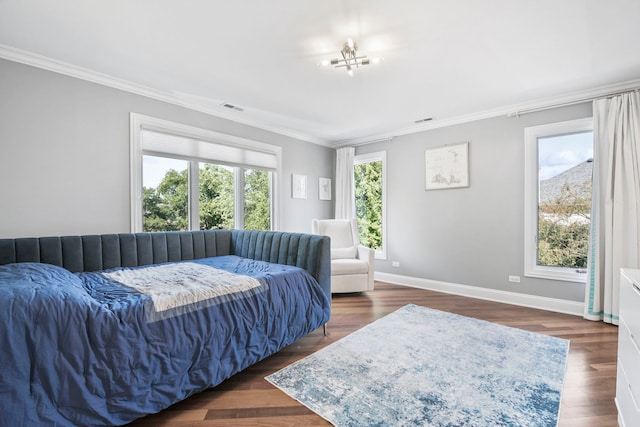 bedroom featuring baseboards, dark wood-style flooring, visible vents, and crown molding