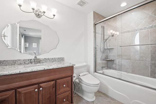 full bathroom featuring visible vents, bath / shower combo with glass door, toilet, tile patterned floors, and vanity