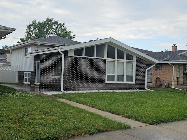 exterior space with a yard