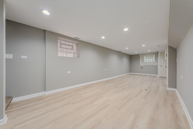 basement featuring light hardwood / wood-style flooring