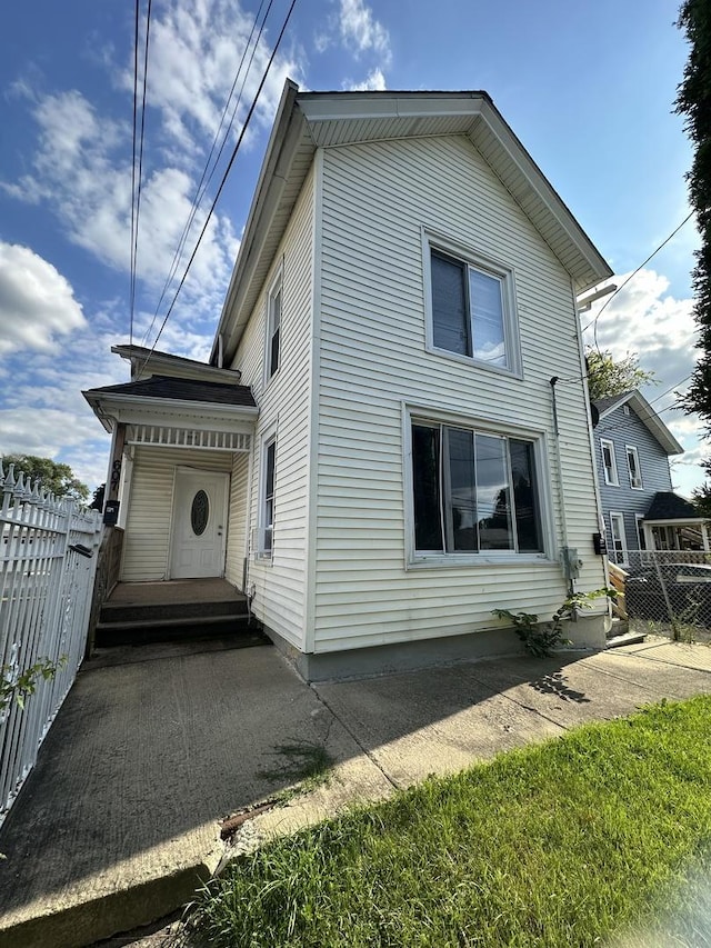 view of side of property with fence