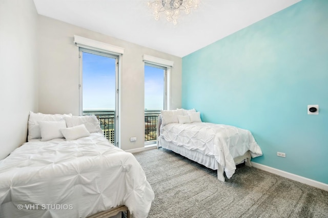 1250 S Michigan Ave Unit 2900, Chicago, IL 60605 - bedroom with a chandelier, carpet, access to outside, and baseboards