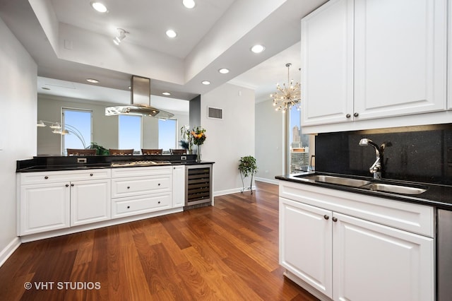 1250 S Michigan Ave Unit 2900, Chicago, IL 60605 - kitchen featuring beverage cooler, island exhaust hood, dark countertops, and a sink