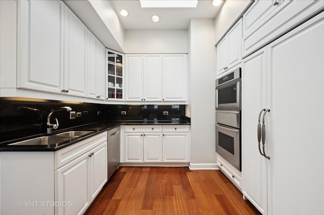 1250 S Michigan Ave Unit 2900, Chicago, IL 60605 - kitchen featuring dark countertops, white cabinetry, and a sink