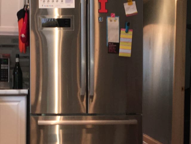 room details with stainless steel fridge