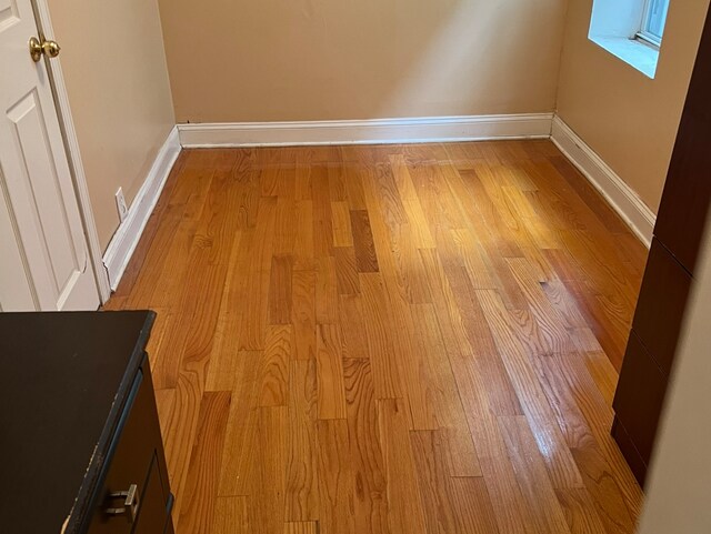 spare room featuring light wood-type flooring