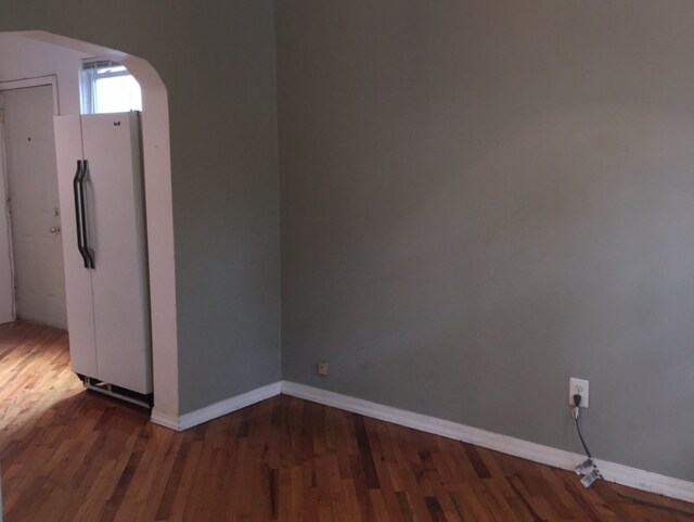 spare room with hardwood / wood-style floors