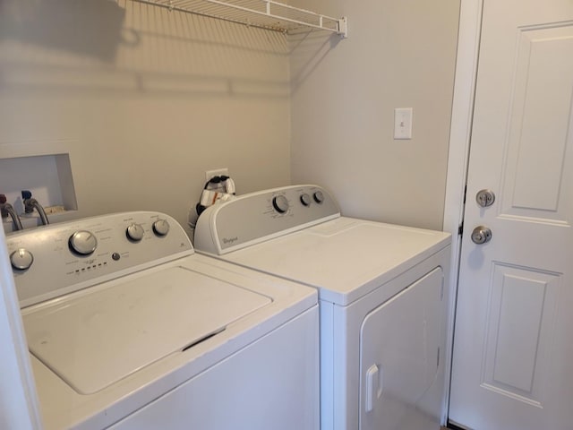 laundry room with separate washer and dryer