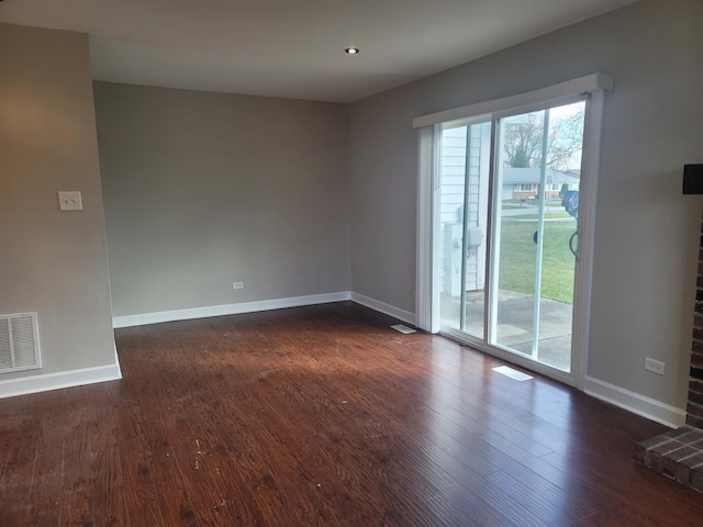 empty room with dark hardwood / wood-style floors