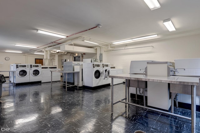 washroom with independent washer and dryer