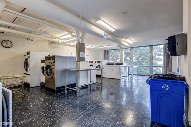 washroom featuring washer and clothes dryer