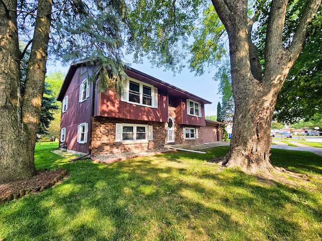 rear view of property with a yard