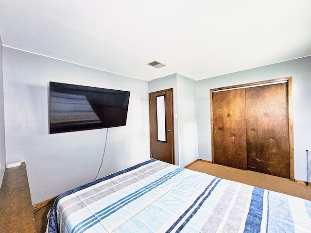 carpeted bedroom featuring a closet