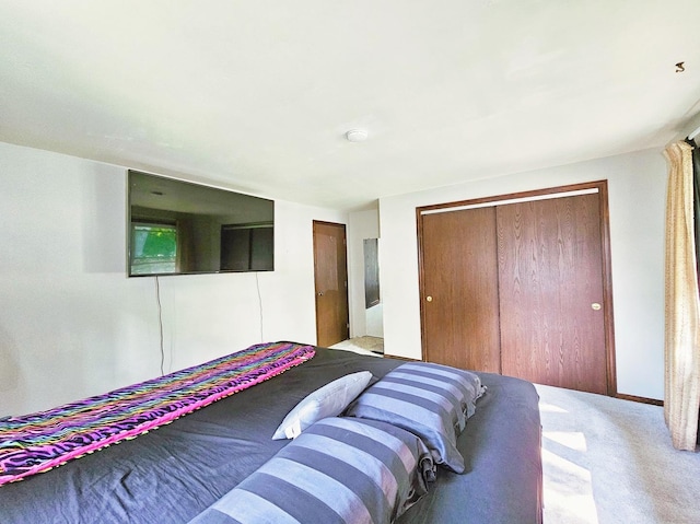 carpeted bedroom with a closet