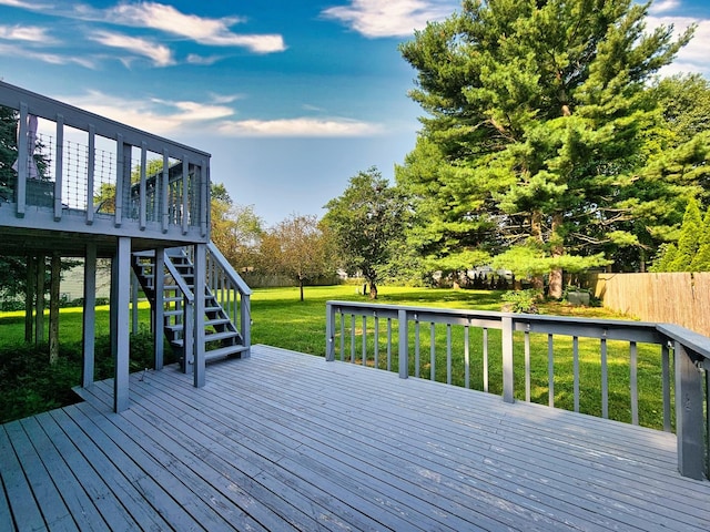 wooden deck with a lawn