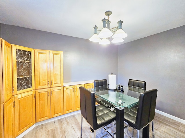 dining space featuring light wood-type flooring