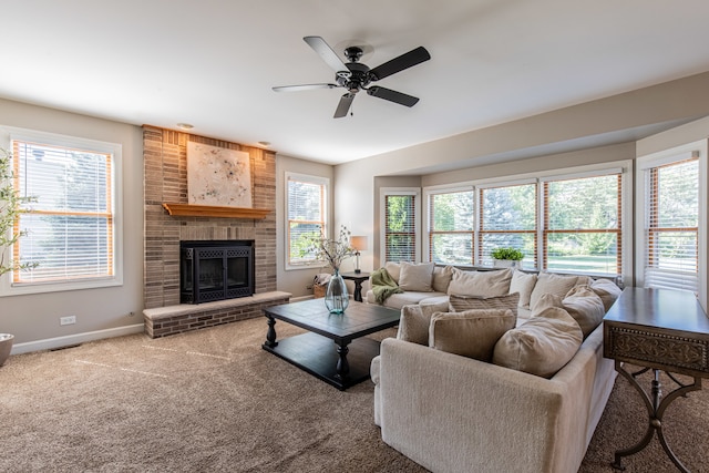 carpeted living room with plenty of natural light, ceiling fan, and a fireplace