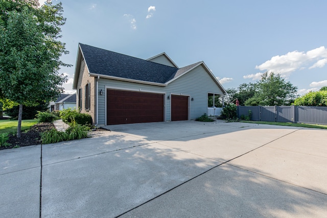 view of property exterior with a garage