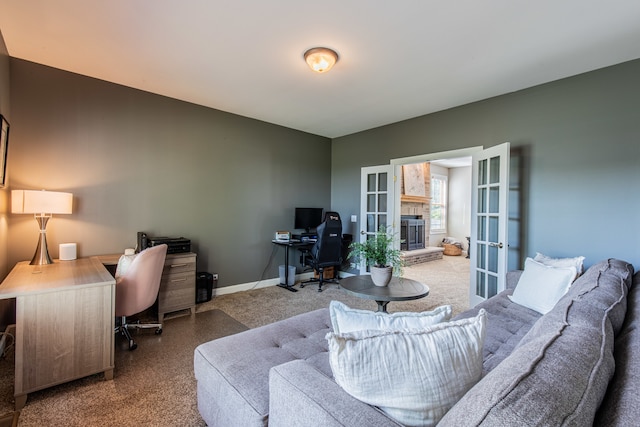 carpeted home office featuring french doors