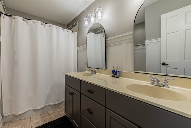 bathroom with tile patterned floors, vanity, and a shower with shower curtain