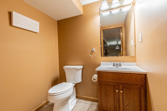 bathroom with tile patterned floors, vanity, and toilet