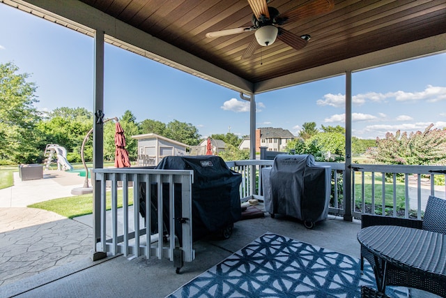 sunroom / solarium with ceiling fan and wooden ceiling