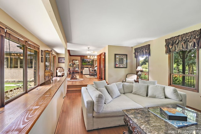 living room featuring hardwood / wood-style flooring and a notable chandelier