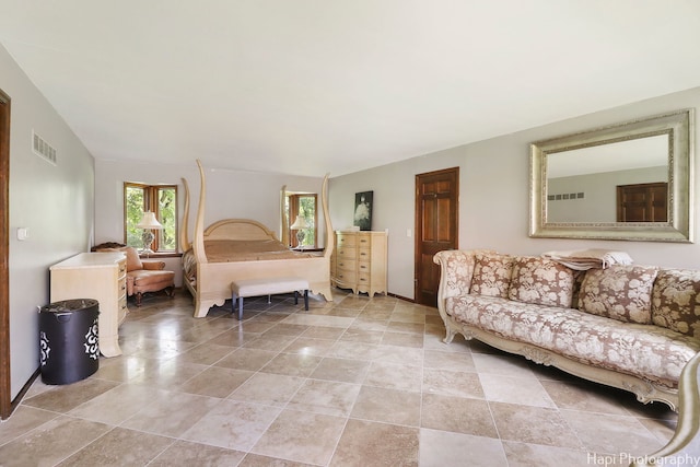 bedroom featuring light tile patterned floors